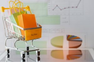 shopping bags on a cart with chart background